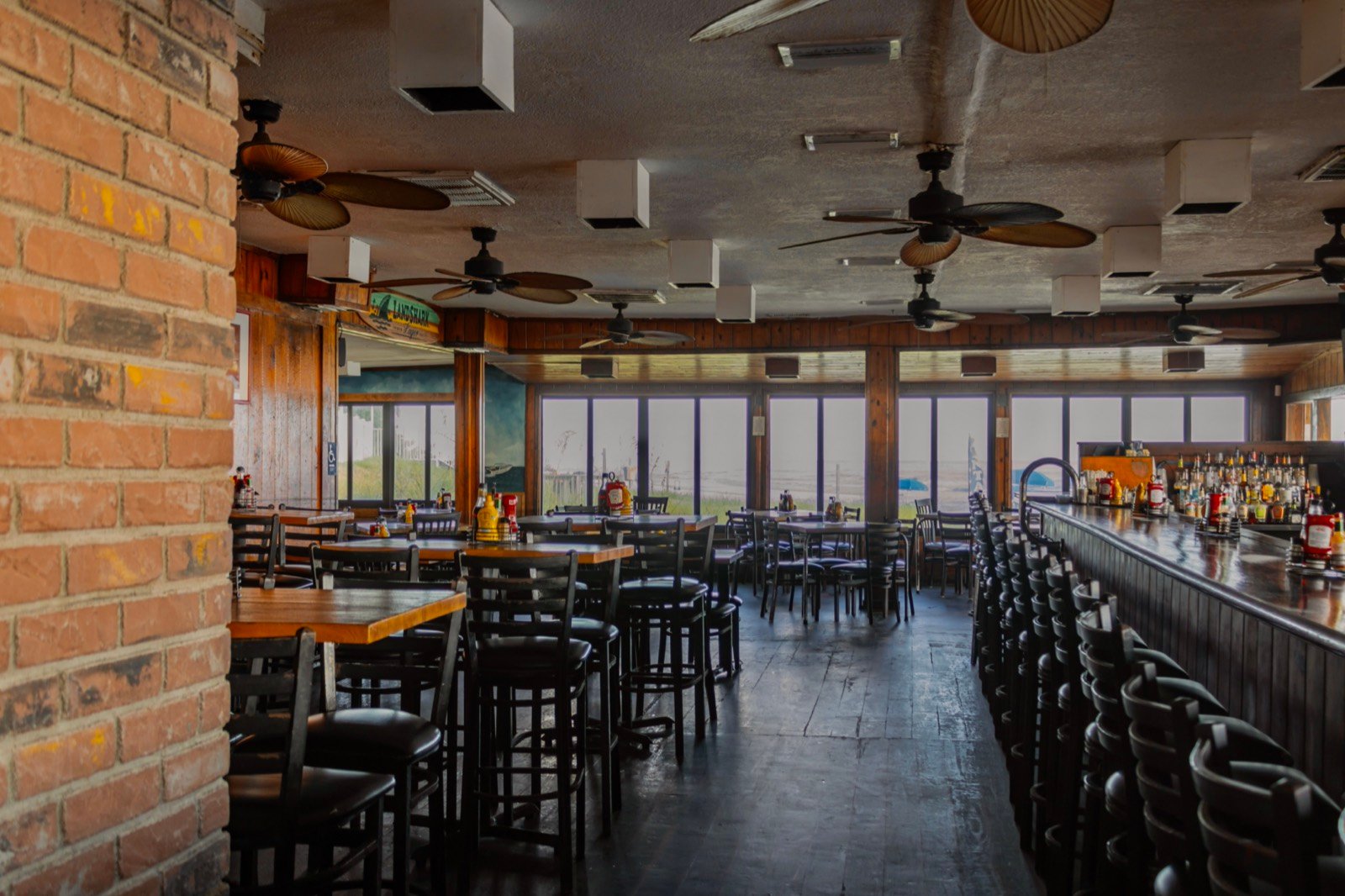 High-top tables at The Breakers bar with ocean views